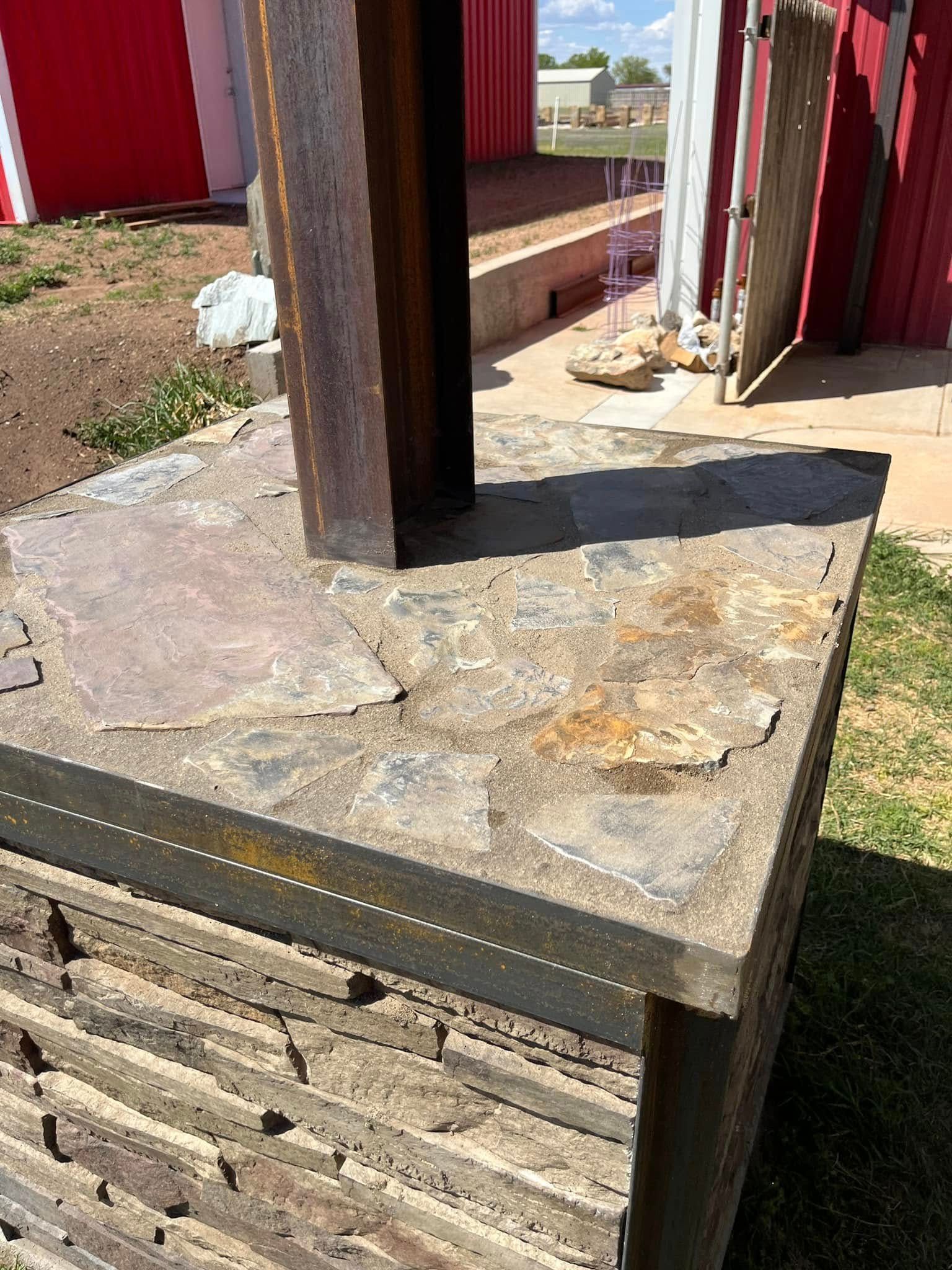 A piece of wood is sitting on top of a concrete surface.