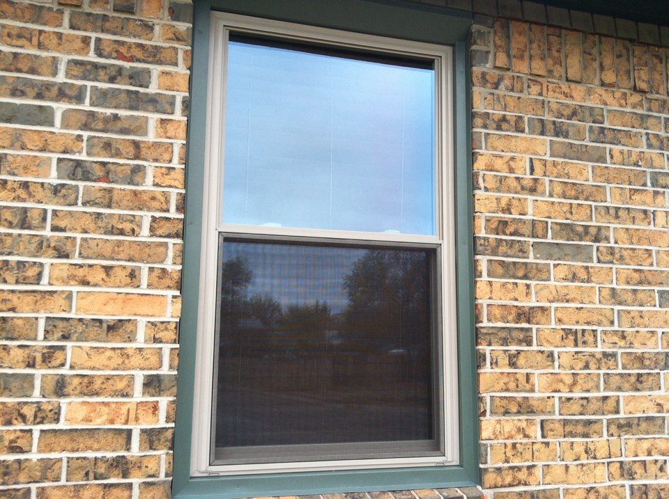 A brick building with a window on the side of it