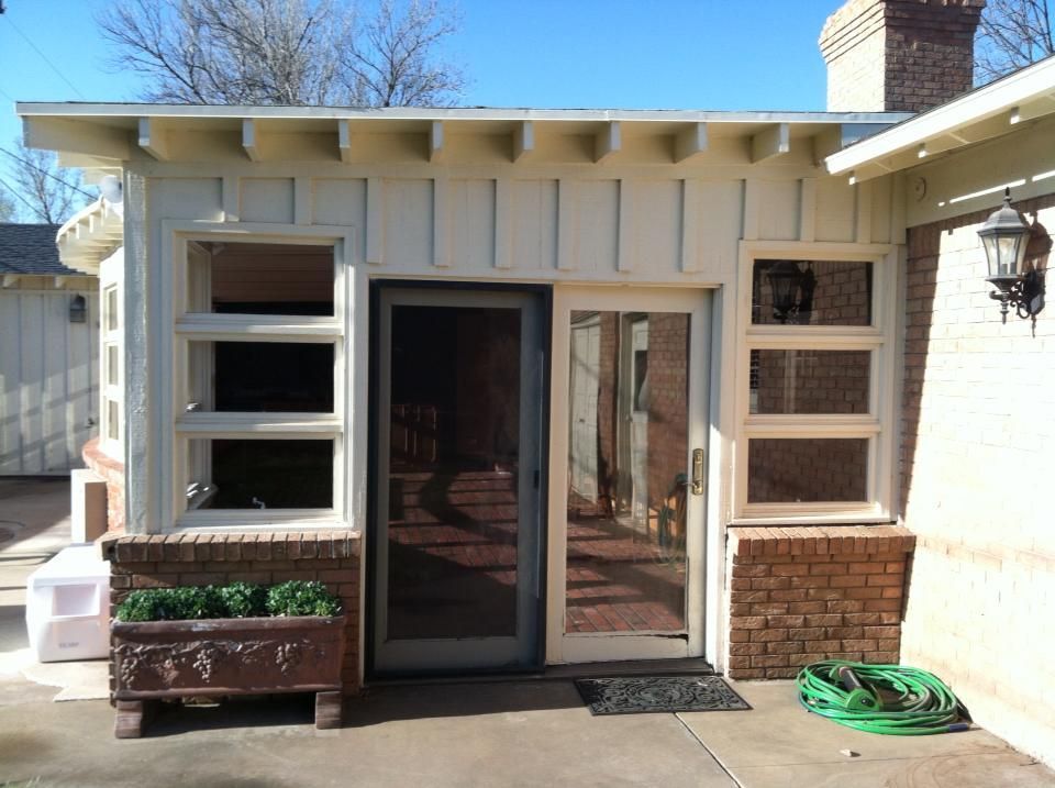 A house with a green hose in front of it