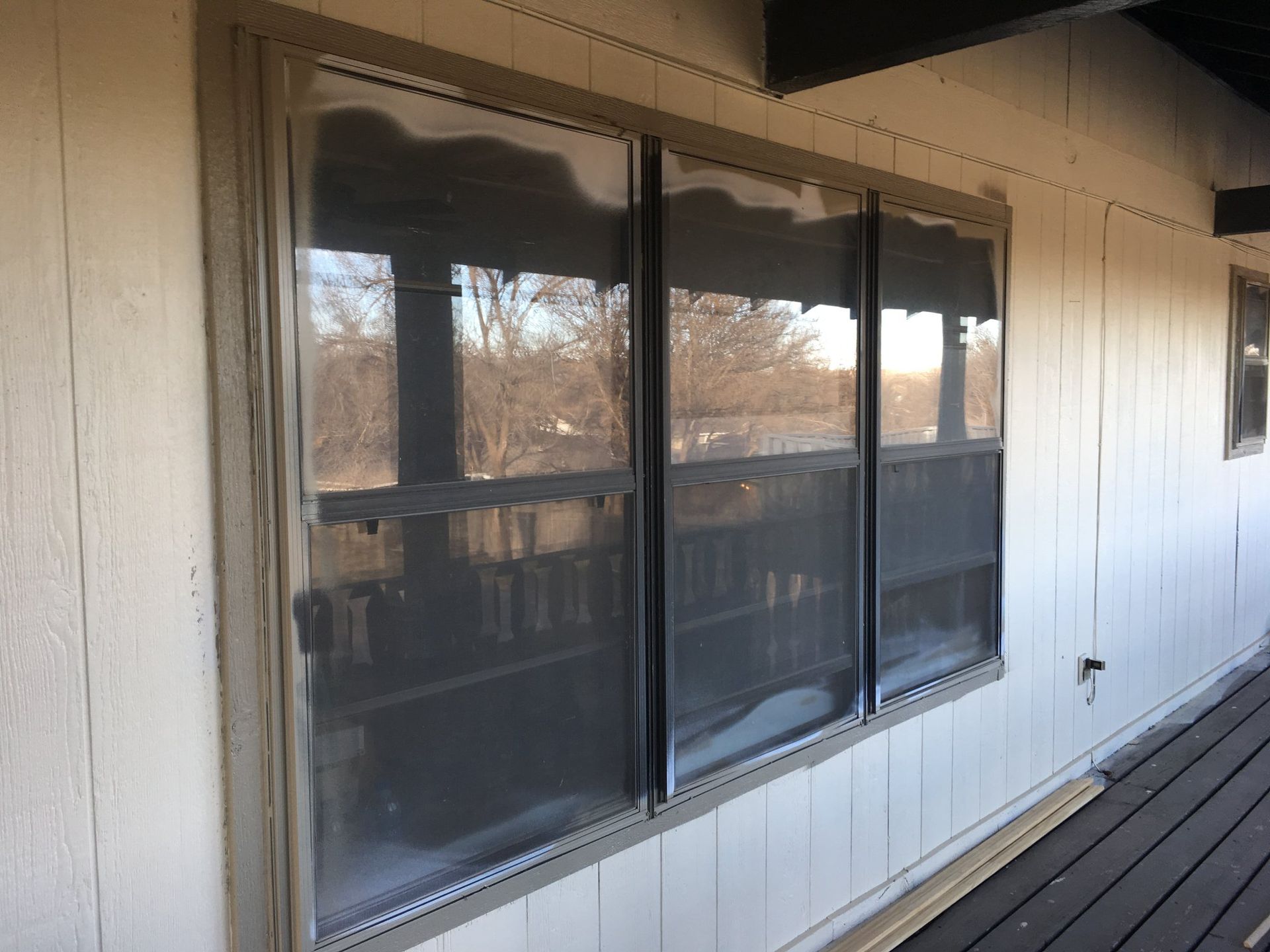 A house with a lot of windows on the side of it