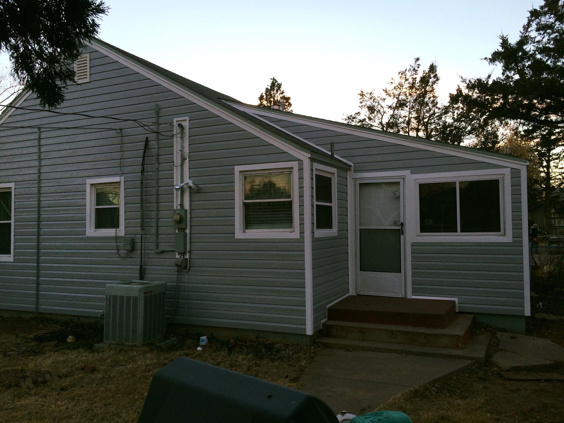 A house with a lot of windows and a door