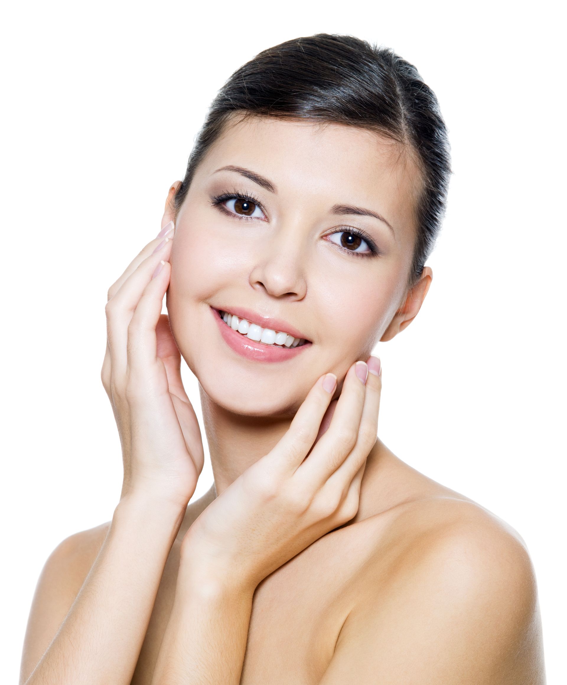 a woman is smiling and touching her face with her hands