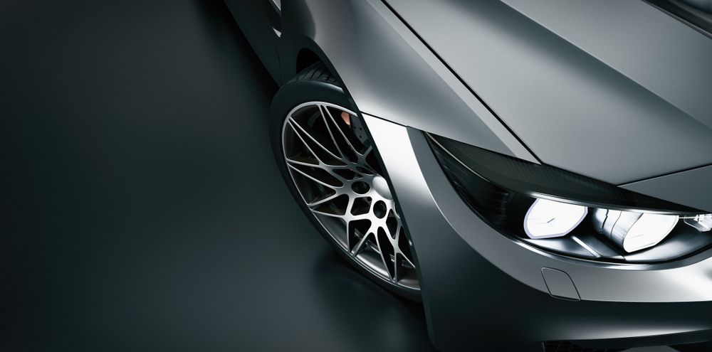 A Close Up Of A Cars Headlight On A Black Background — Taminda Smash Repairs In Gunnedah, NSW