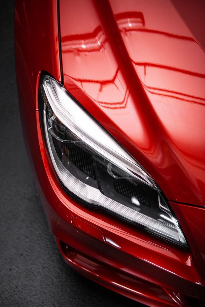 A Close Up Of A Red Cars Headlight — Taminda Smash Repairs In Quirindi, NSW