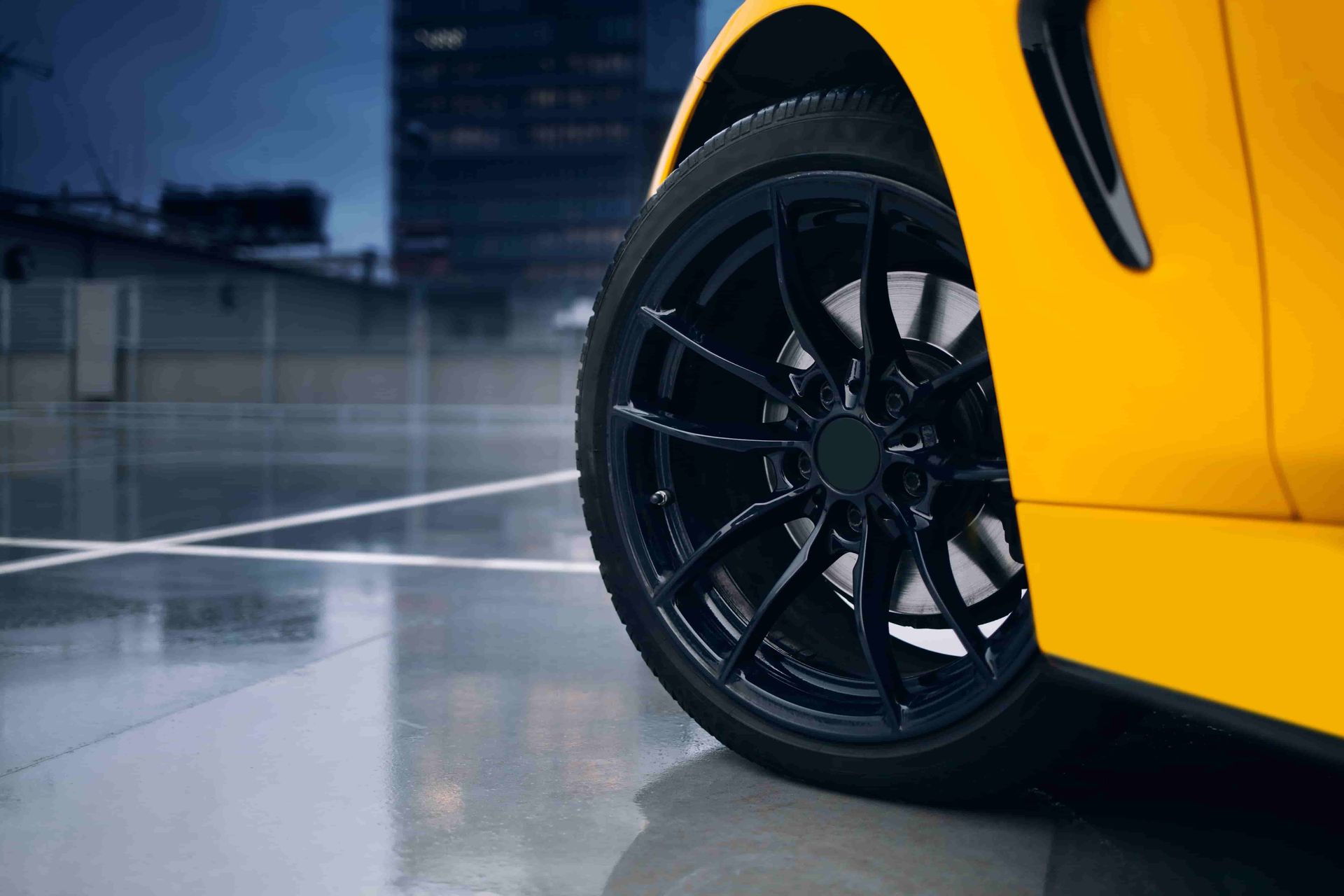 A Yellow Sports Car With Black Wheels Is Parked In A Parking Lot — Taminda Smash Repairs In Taminda, NSW