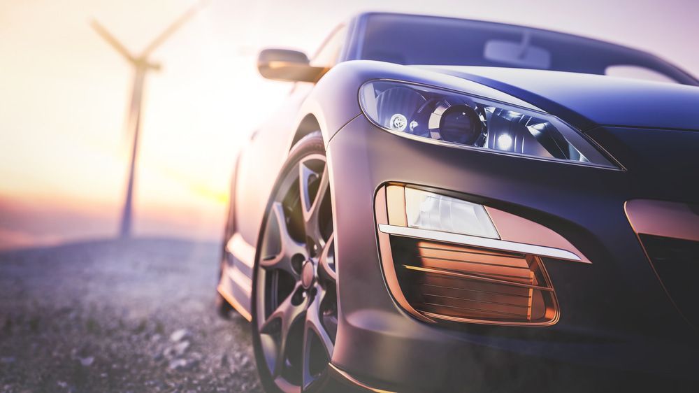A Close Up Of A Car Parked On A Dirt Road With A Windmill In The Background — Taminda Smash Repairs In Walcha, NSW