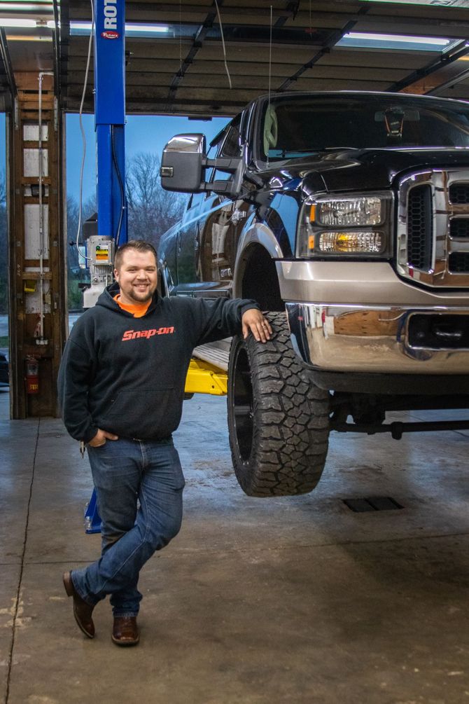 Mechanic at work under the car | Elite Diesel and Auto