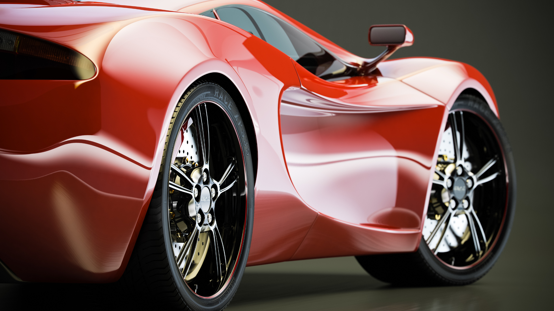A close up of a red sports car with black wheels