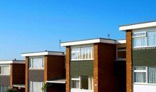 A row of buildings with flat roofs