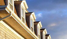 A row of homes with roof windows