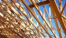 Timber roof beams on an unfinished roof