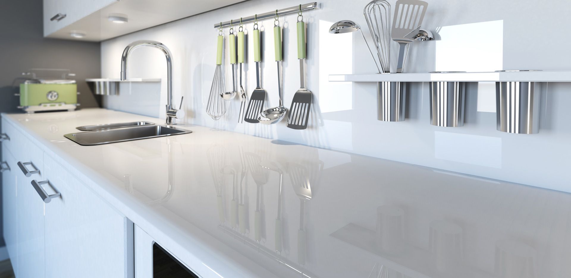 A kitchen with white cabinets , a sink , and utensils hanging on the wall.