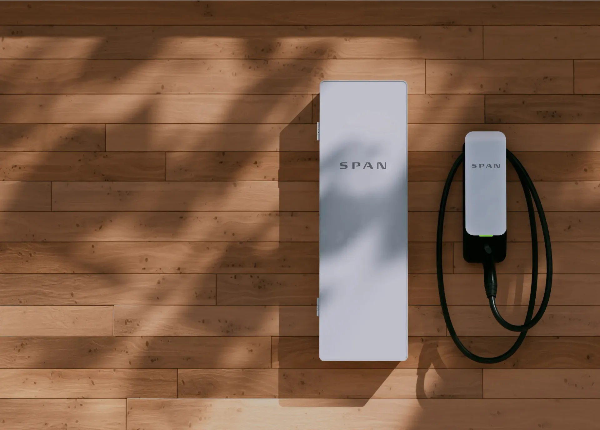White electrical panel and EV charger on a wood-paneled wall, sunlight casting shadows.