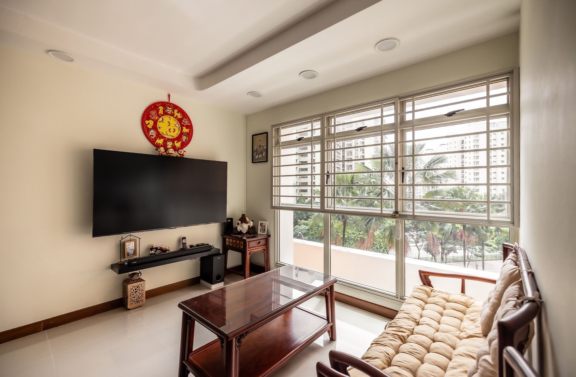 A living room with a couch , table , and television.