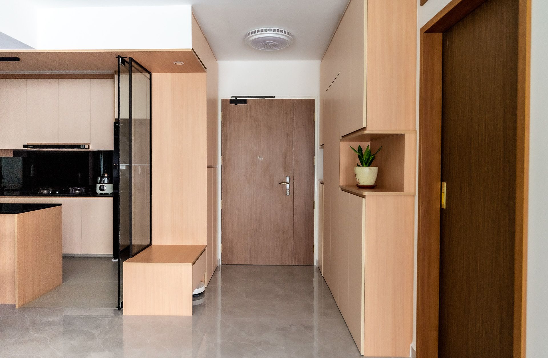 A kitchen with wooden cabinets and a sliding glass door