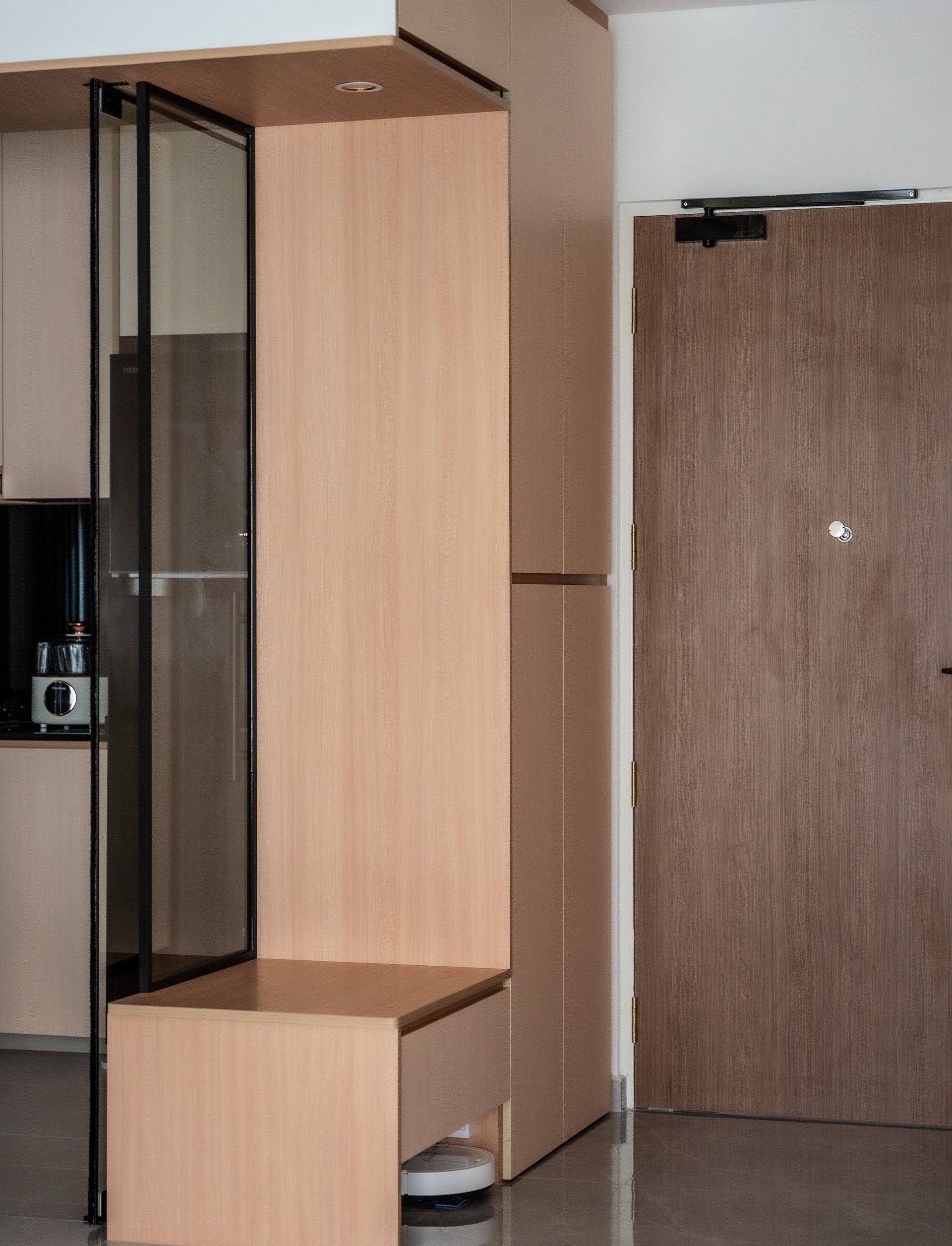 A room with a wooden door and a wooden cabinet