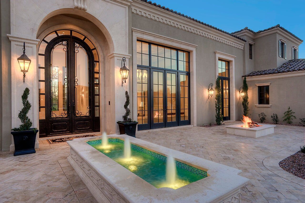 Formal Mediterranean Luxury Home front yard