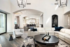 A living room filled with furniture and a round coffee table.