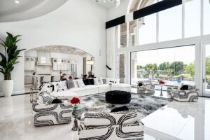 A living room filled with furniture and a large window.