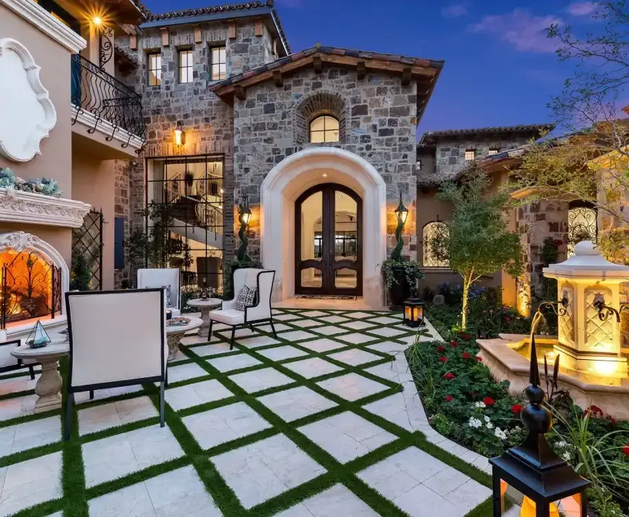 French-style estate with arched doorways and detailed moldings