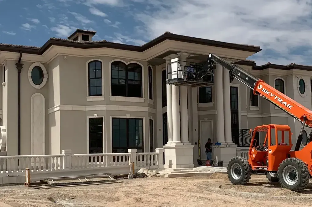 Luxury custom home exterior during construction showcasing high-end architectural design