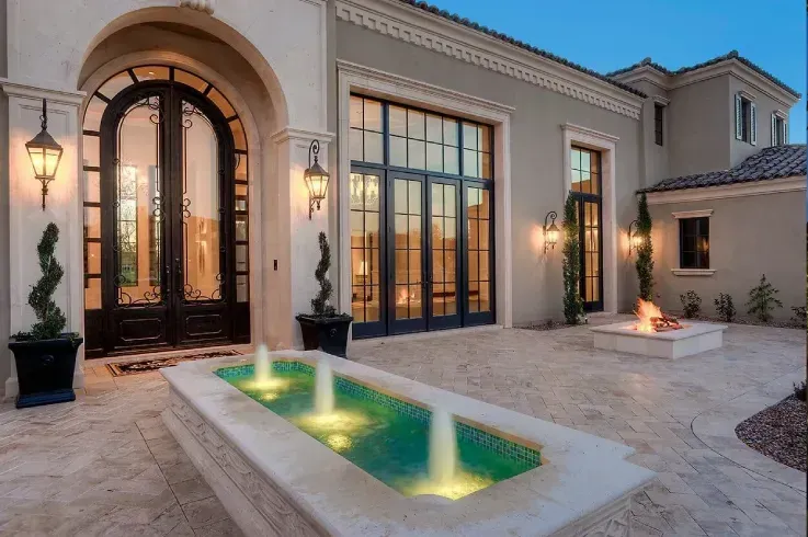 Mediterranean courtyard with fountain and seating for relaxing and entertaining