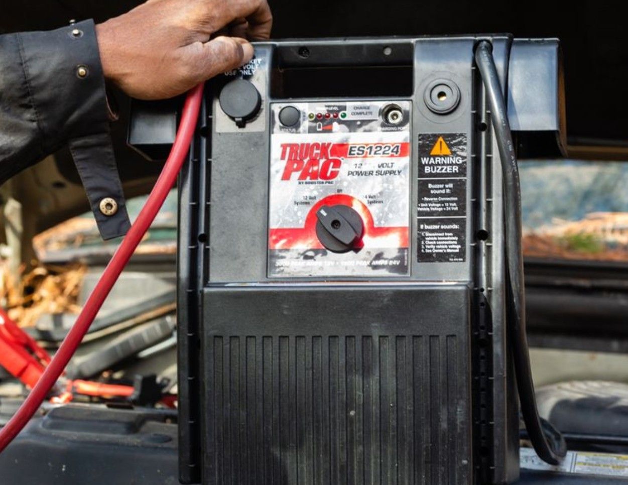 A battery jumpstart pack on a car