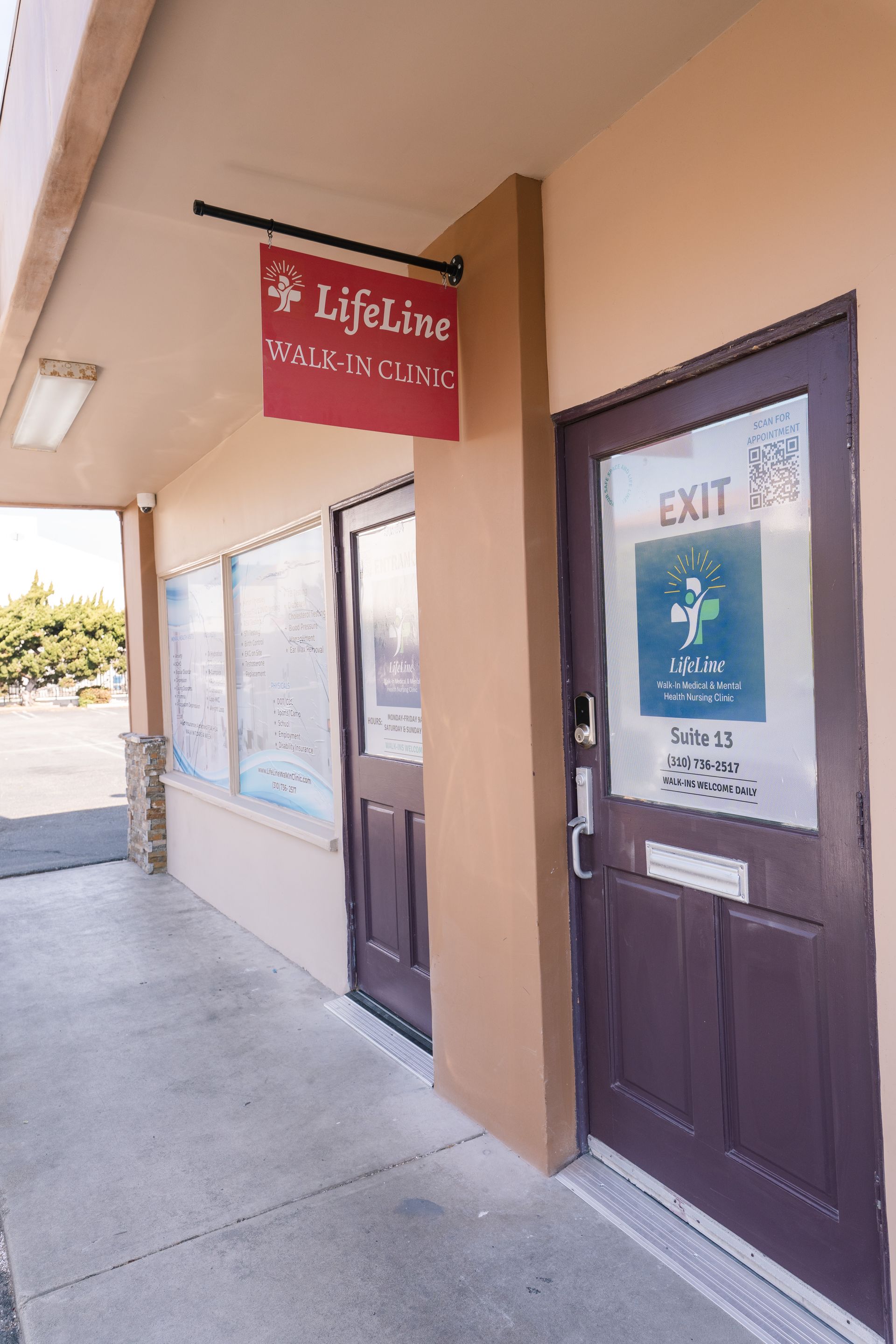 Exterior of Lifeline Health Clinic with sign and door labeled 