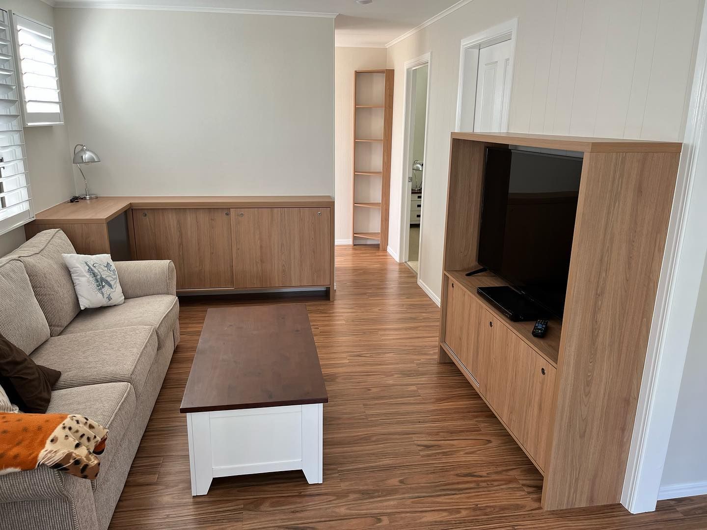 A Cosy Living Room with a Couch, Coffee Table, and Television — Expert Cabinetmaker on the Sunshine Coast QLD