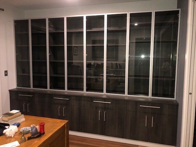 A Room with Abundant Cabinets and Glass Doors for Functional Storage and Style — Expert Cabinetmaker on the Sunshine Coast QLD