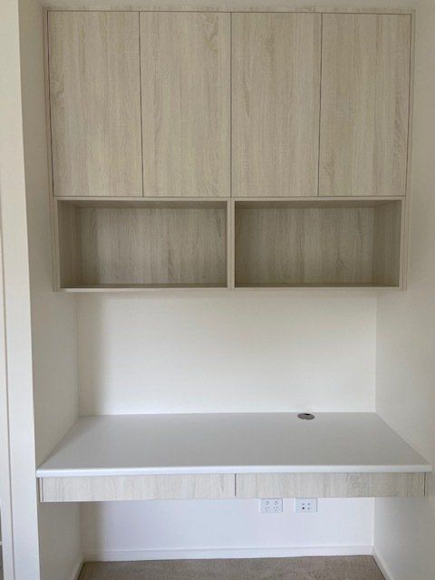 A White Desk with Shelves Above, Set in a Bright Room — Expert Cabinetmaker on the Sunshine Coast QLD