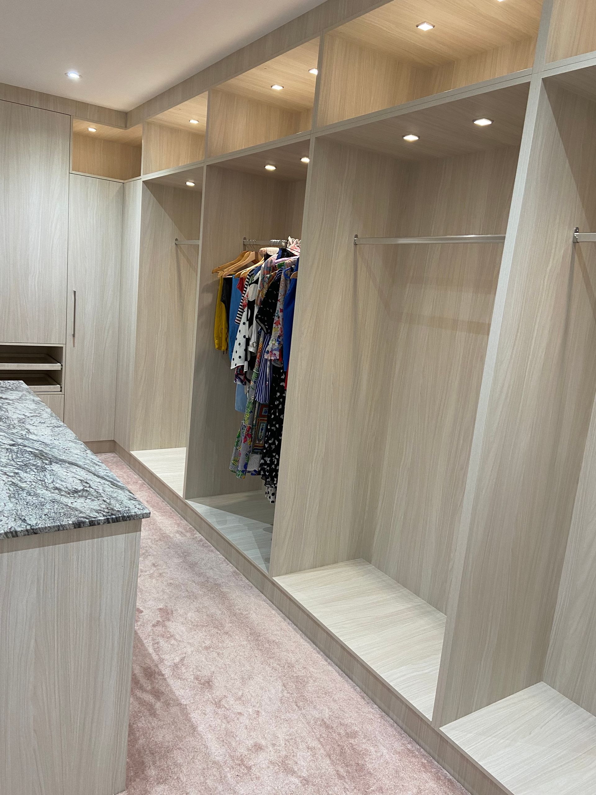 A Bedroom with Wooden Cabinets and a Carpeted Floor — Wardrobes on the Sunshine Coast QLD