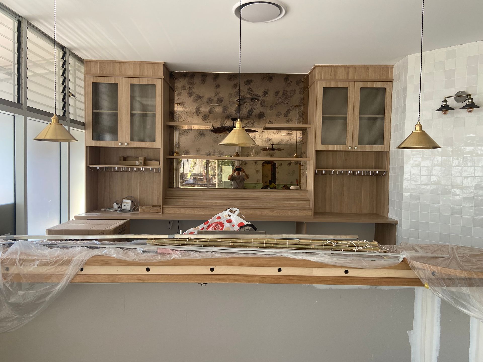 View of Black Kitchen Cabinets 
Window — Against the Grain Cabinetry in Rosemount, QLD