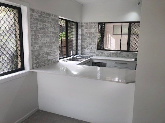 A Kitchen with Countertop, Sink, and Window — Expert Cabinetmaker on the Sunshine Coast QLD