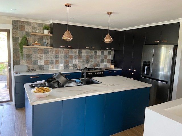 A Kitchen with Blue Cabinets and a Spacious Island — Expert Cabinetmaker on the Sunshine Coast QLD