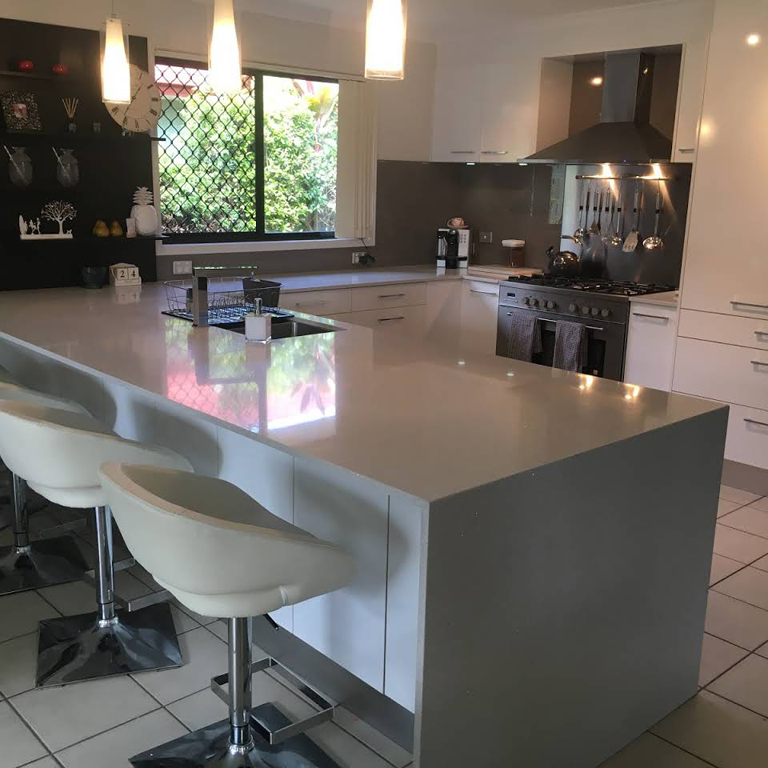 A Kitchen Featuring White Cabinets and Countertops — Expert Cabinetmaker on the Sunshine Coast QLD