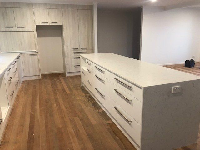 In the Kitchen, a Sizable Island Stands Prominently — Expert Cabinetmaker on the Sunshine Coast QLD