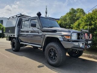 A Toyota Land Cruiser is Parked on the Side of the Road — Dynamic Performance Systems In Kelso, NSW