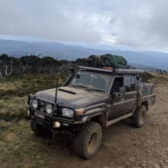 A Truck is Parked on a Dirt Road With Mountains in the Background — Dynamic Performance Systems In Kelso, NSW