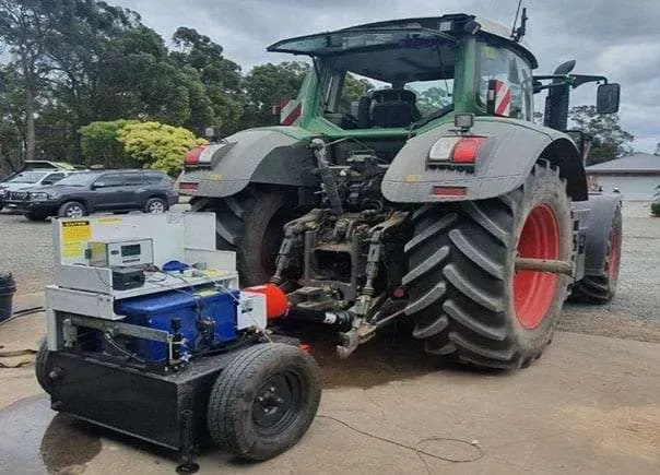 A Tractor With a Trailer Attached to It is Parked in a Parking Lot — Dynamic Performance Systems In Kelso, NSW