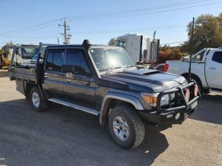 A Black Truck is Parked in a Parking Lot Next to a White Truck — Dynamic Performance Systems In Kelso, NSW