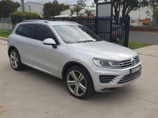 A Silver Volkswagen Touareg is Parked in a Parking Lot — Dynamic Performance Systems In Kelso, NSW