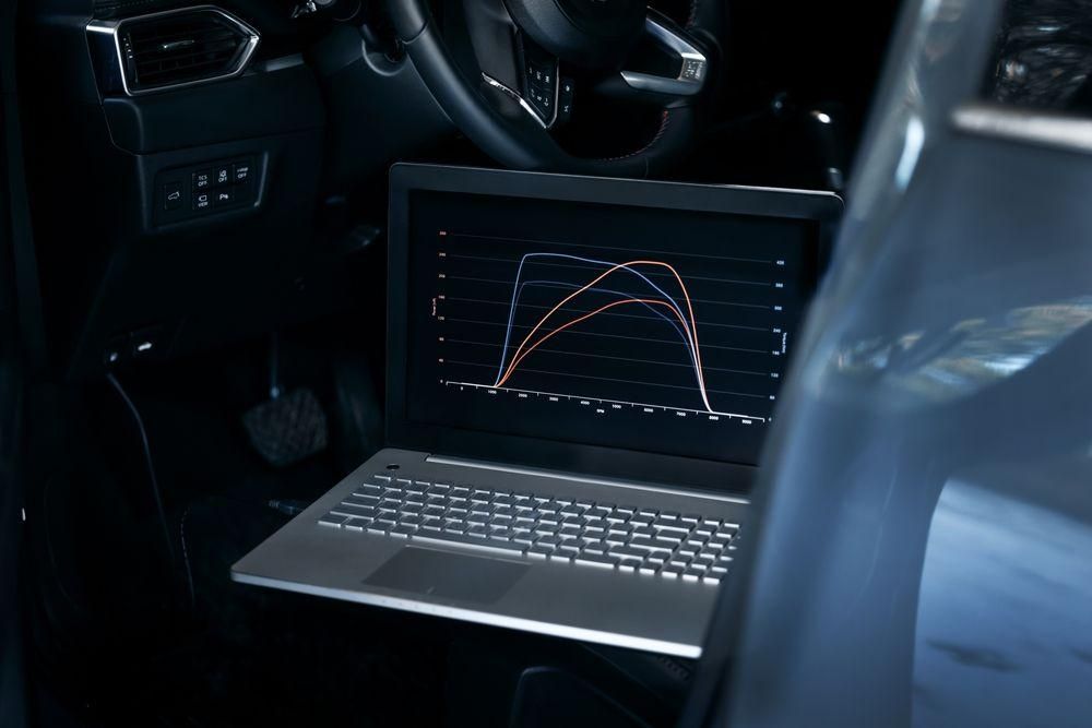 A Laptop Computer is Sitting in the Back Seat of a Car — Dynamic Performance Systems In Kelso, NSW