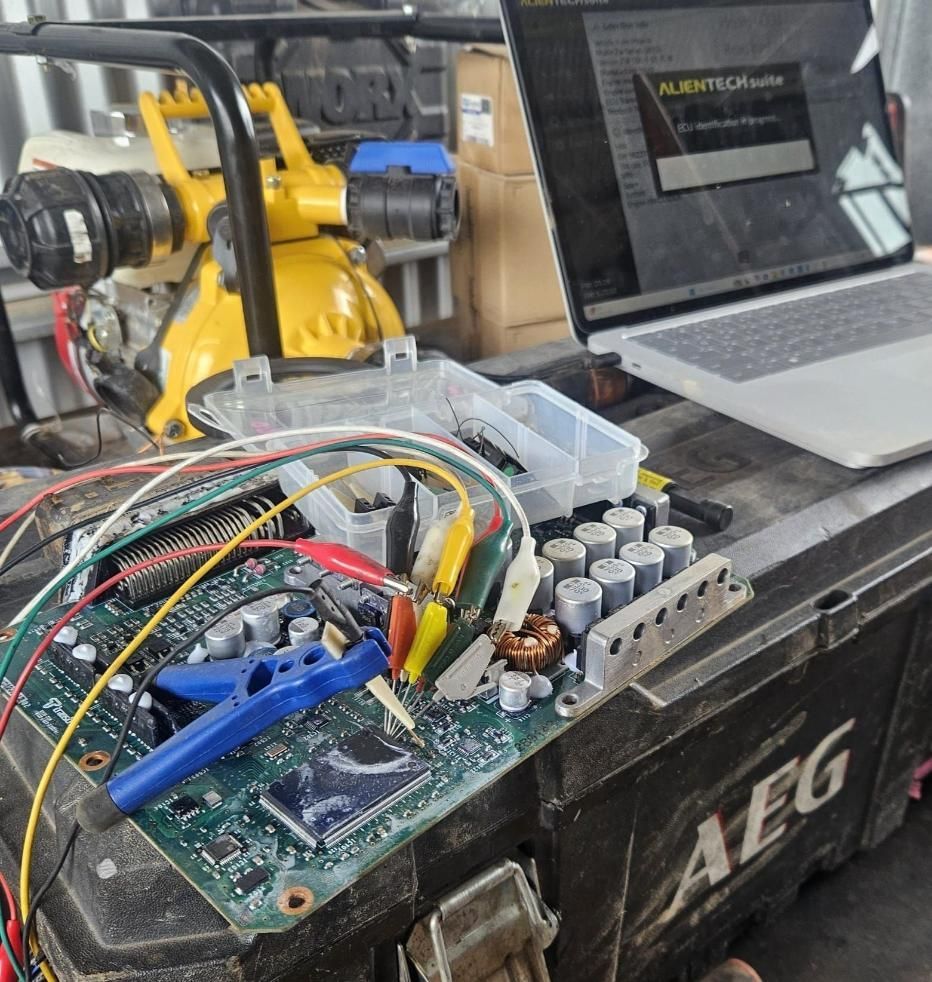 A Laptop is Sitting on a Table Next to a Box That Says Aeg — Dynamic Performance Systems In Kelso, NSW