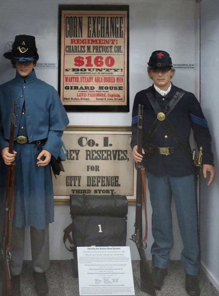 Two soldiers standing in front of a sign that says corn exchange