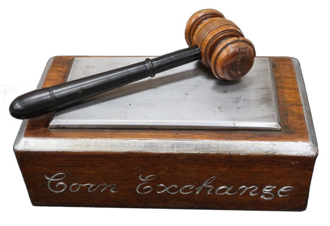 A wooden box with the word corn exchange on it