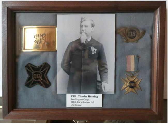Shadow box display of Civil War artifacts: photo of Col. Charles Boring flanked by military items.