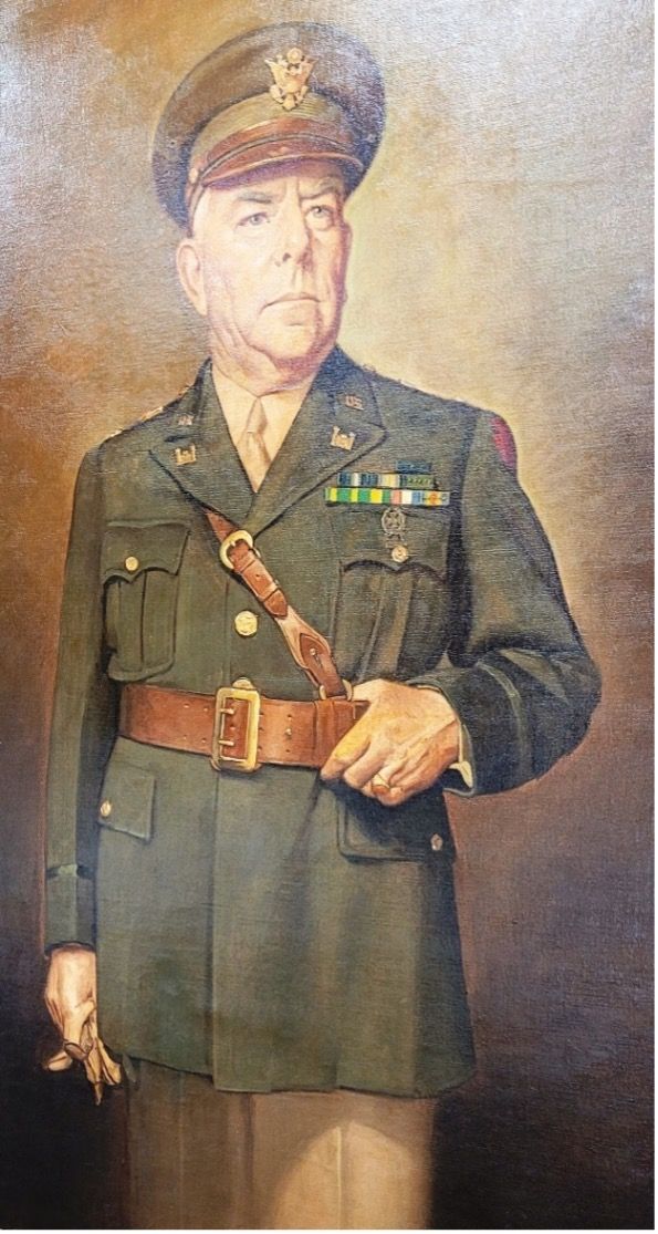 Portrait of a military officer in uniform, wearing a hat and medals, standing with a serious expression.