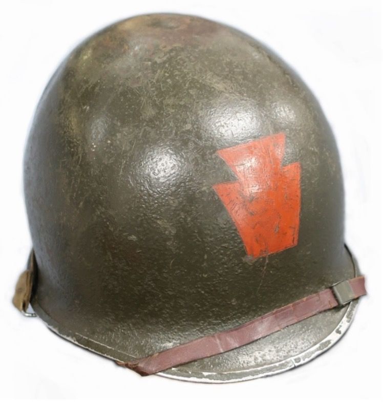 A helmet with a red arrow painted on it