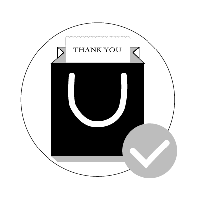 a black shopping bag with a thank you tag attached to it